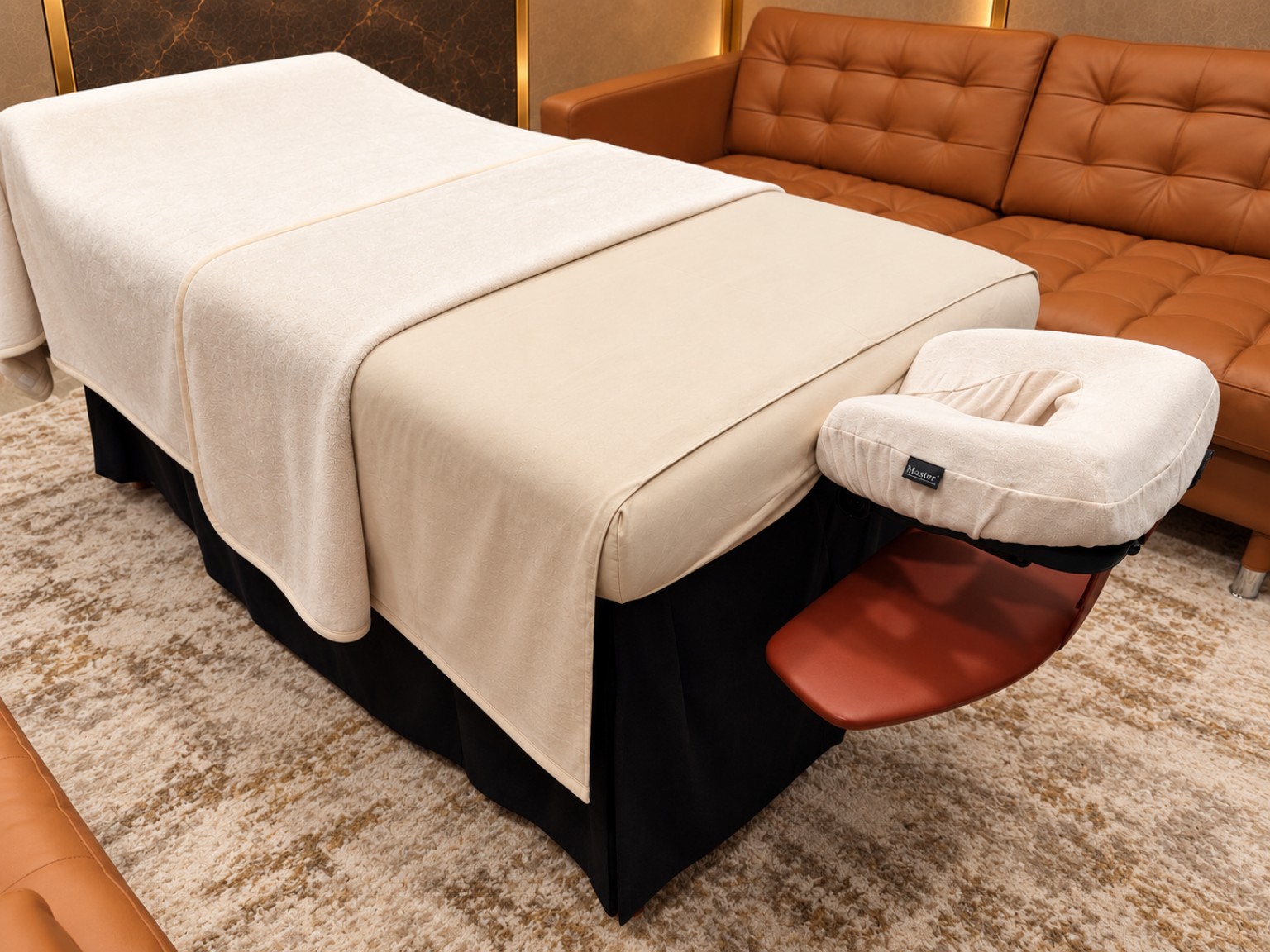 Premium linens and professional face cradle prepared for a private treatment by The Vesuve